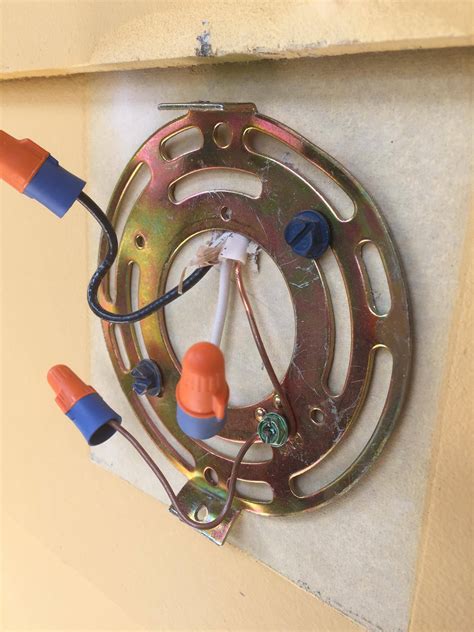 Press the junction box of your track lighting system to the ceiling, trace around the box and cut out this area. . Installing junction box for outdoor light